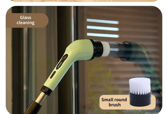 Small round brush head cleaning a glass window